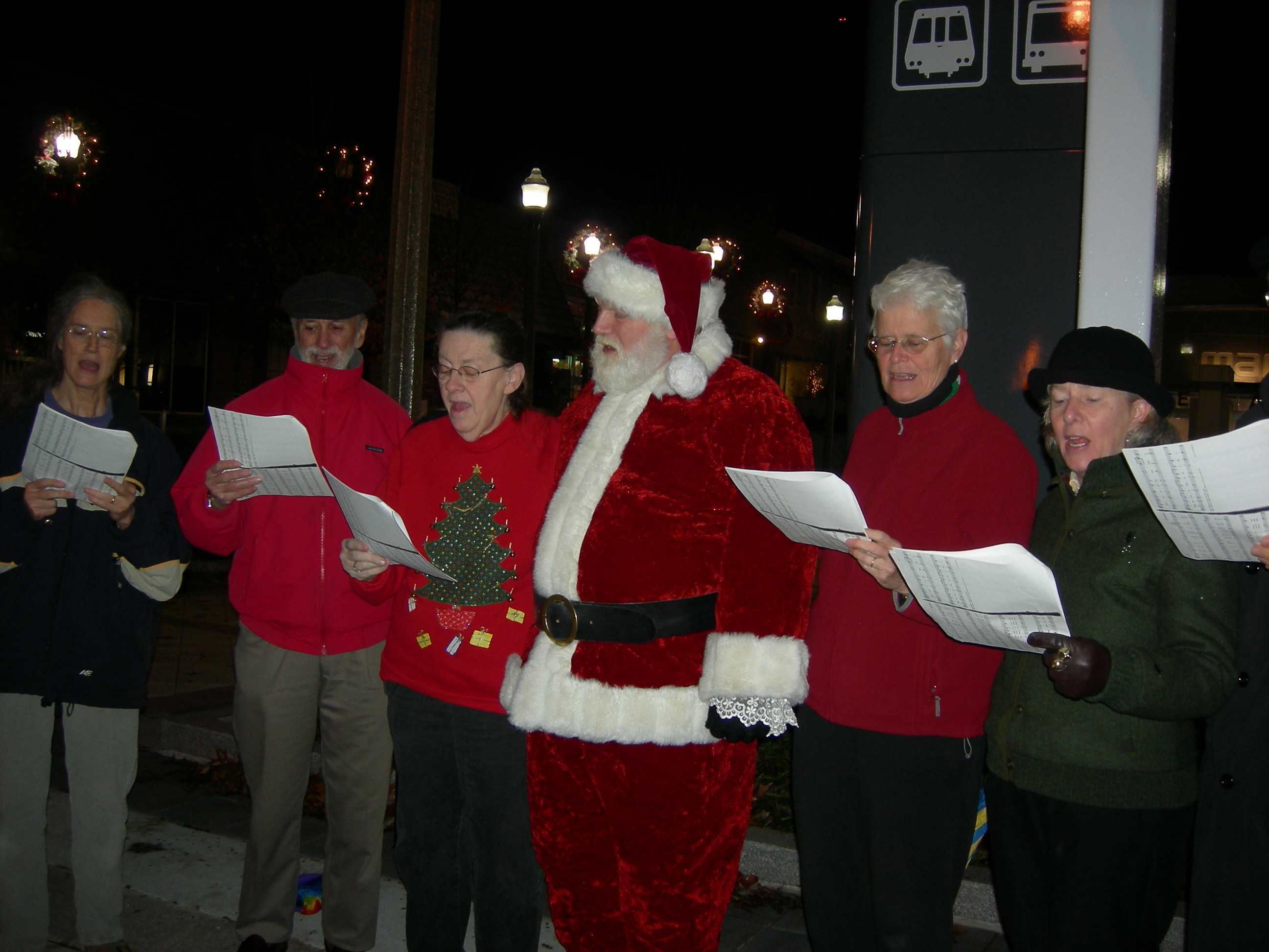 Santa joins carolers on Church Street