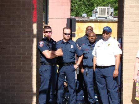 A Few of Decatur's Firefighters Observe the Ribbon Cutting